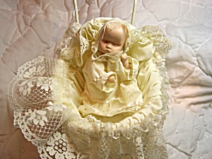 Porcelain Baby Doll In Wicker Carriage
