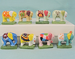Tiny Herd Of Eight Colorful Porcelain Elephants