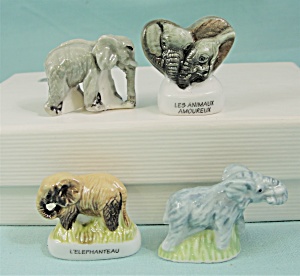 Tiny Herd Of Four Porcelain Elephants