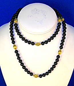28 Inch Necklace Of 7mm Black Onyx/gold Beads