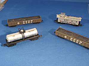 Four Miniature Train Cars